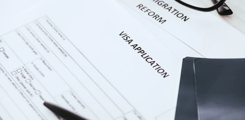 Documents assembled for a Japan visitor visa application from Dubai including the schedule of stay