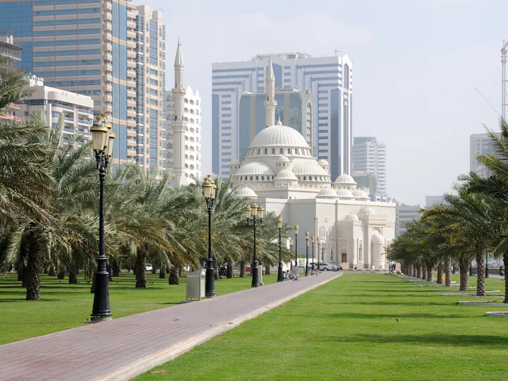 Al Noor Mosque and palm-lined waterfront in Sharjah