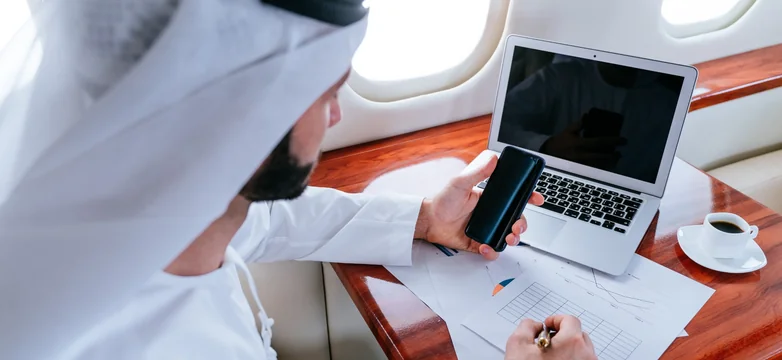 Applicant completing the DS-160 form on a laptop in Dubai