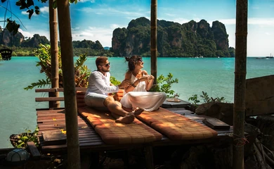 Longtail boat and limestone scenery in Krabi, Thailand