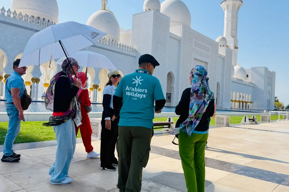 Arabiers guide with guests outside Sheikh Zayed Grand Mosque Abu Dhabi