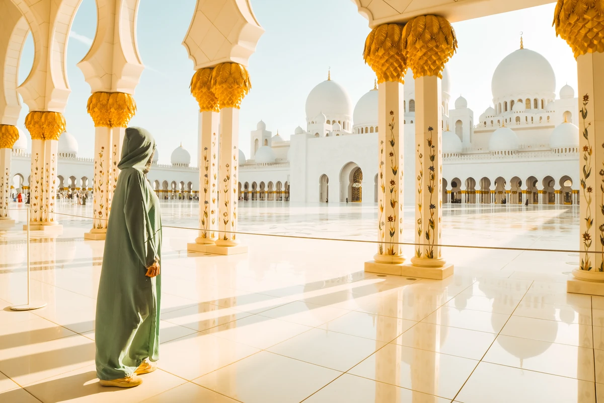 Sheikh Zayed Grand Mosque courtyard and domes near sunset